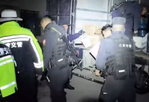 Homes Cracked, Aftershocks Coming: Is Tibet’s Rescue Just Beginning? Police officers loading earthquake relief supplies into a truck at night in Nagqu, Tibet, after a magnitude 7 earthquake.