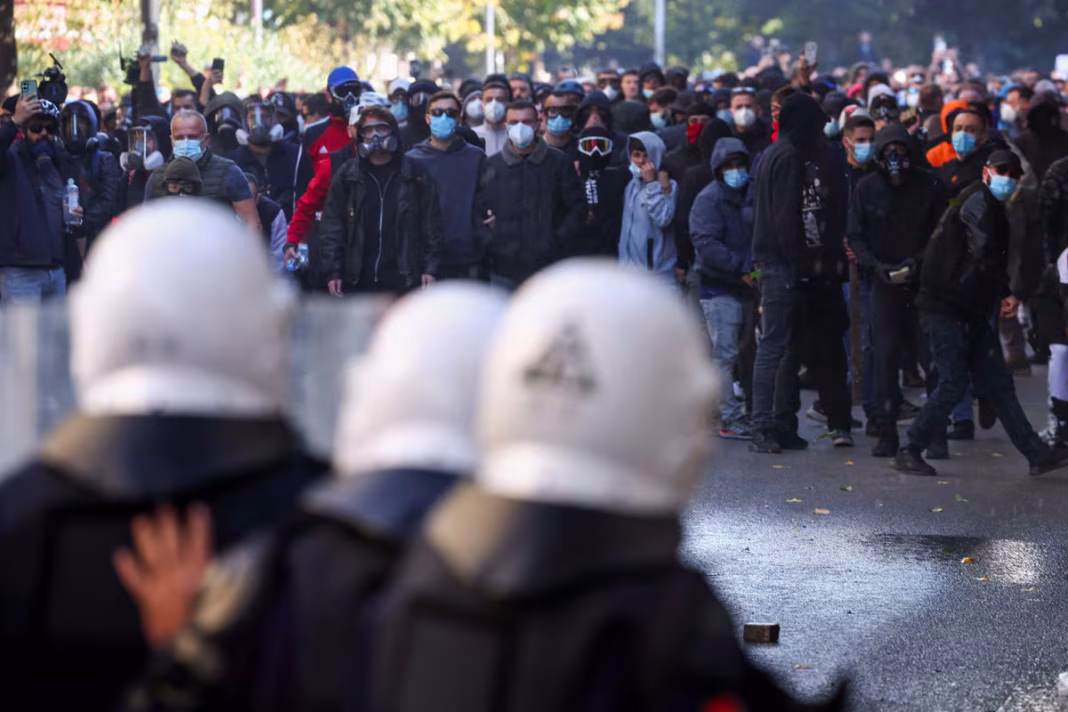 Image showing riot police confronting protesters in Albania and smoke-filled clashes outside Albania's Education Ministry in Tirana, October 2026.